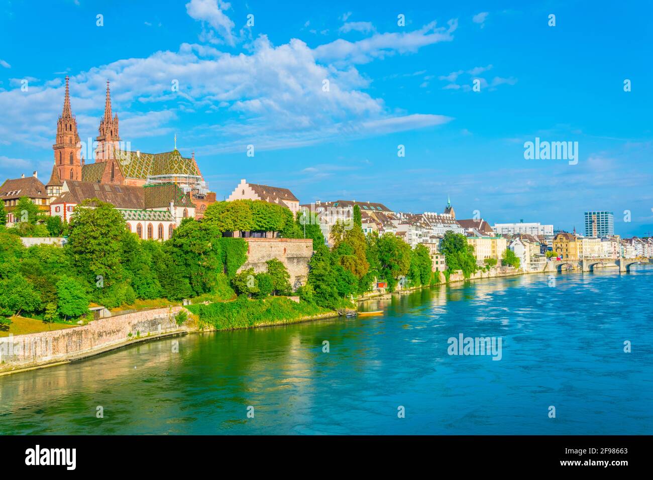Riverside of Rhine in Basel dominated by majestic building of Munster ...