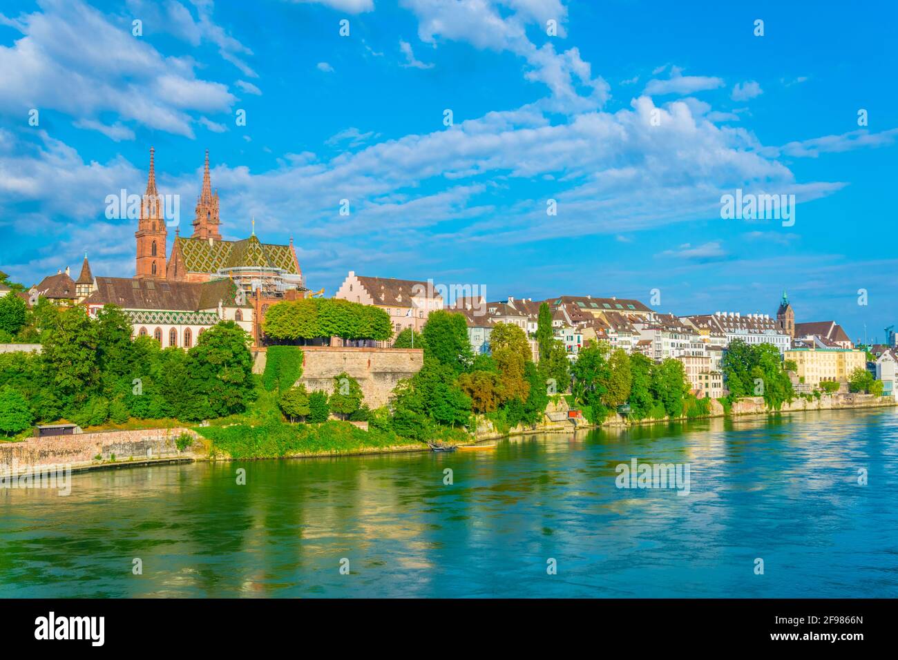 Riverside of Rhine in Basel dominated by majestic building of Munster ...