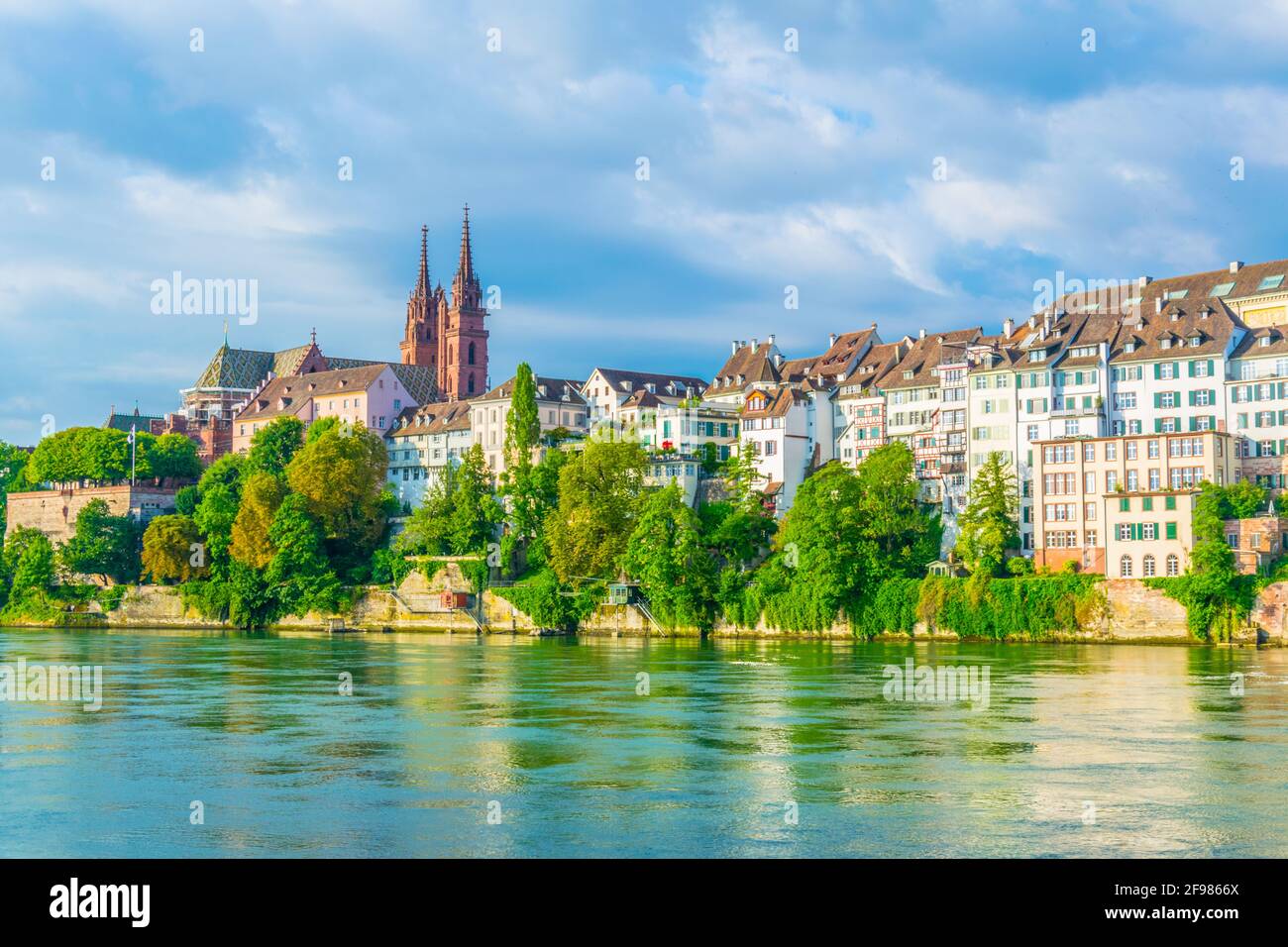 Riverside of Rhine in Basel dominated by majestic building of Munster ...