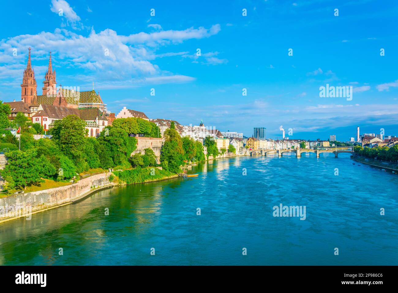 Riverside of Rhine in Basel dominated by majestic building of Munster ...
