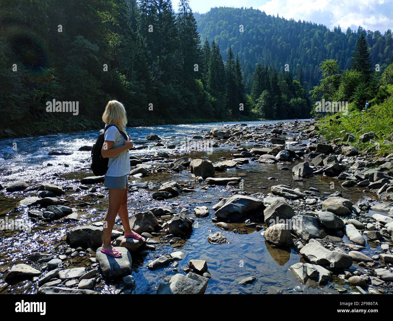 Hiker looking at landscape while summer hot day Stock Photo