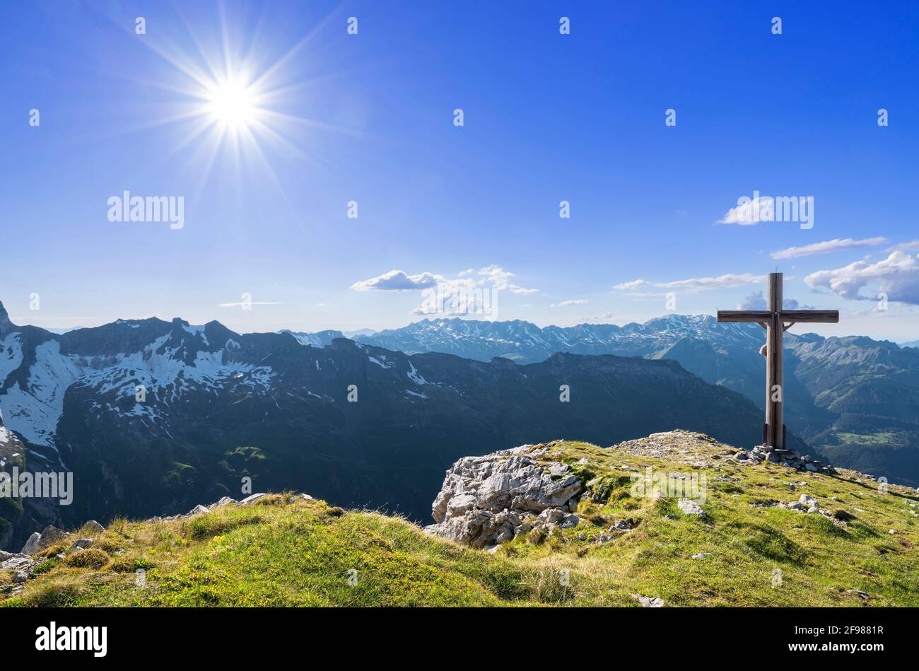 Alpine mountain landscape with summit cross on a sunny summer day. View to the Nebelhorn. Allgäu Alps, Bavaria, Germany Stock Photo