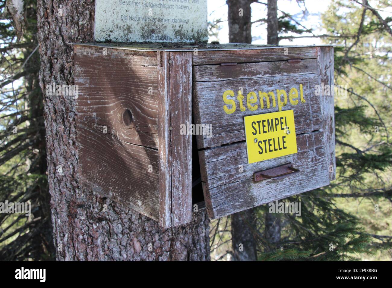 Winter hike to Grünkopf near Mittenwald, Europe, Germany, Bavaria, Upper Bavaria, Isar Valley, stamping point, possibility to stamp the hike in a scrapbook. Box, box, wood Stock Photo