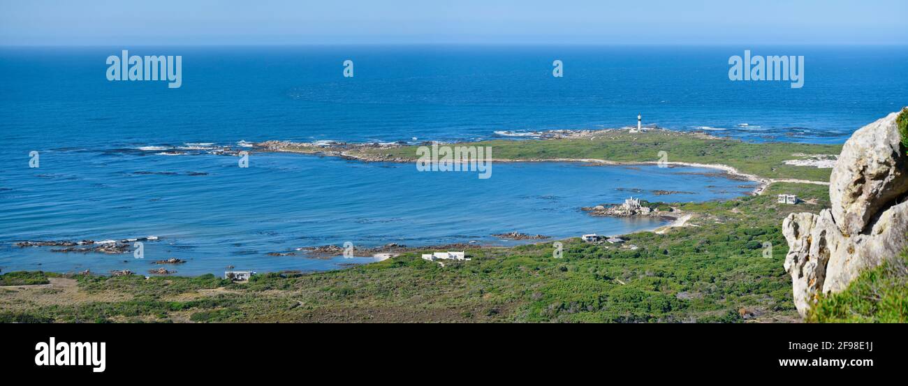 Seascape of Cape Hangklip lighthouse and surrounding, homes, vegetation, dunes an bays, near Betty's Bay, South Africa. Stock Photo