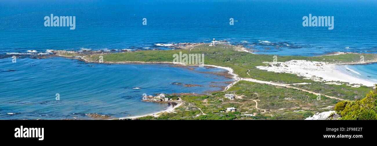 Seascape of cape hangklip lighthouse and surrounding vegetation hires