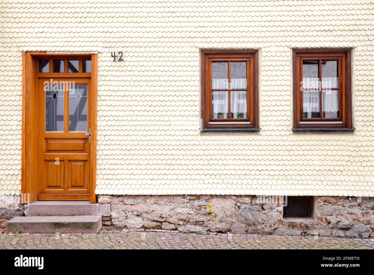 House facade, front door, window, minimalist, wooden shingles, Alsfeld, Vogelsbergkreis, Hesse, Germany, Europe Stock Photo