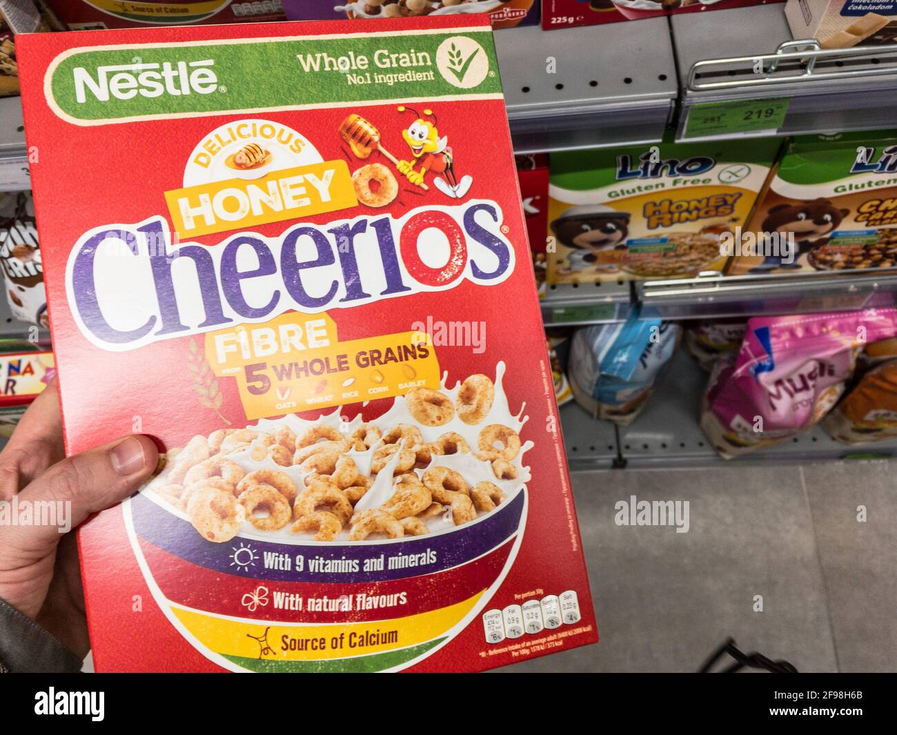 BELGRADE, SERBIA - APRIL 12, 2021: Honey Cheerios logo on boxes of Cereal for sale. Part of Nestle and General Mills, Cheerios is a brand of honey fla Stock Photo