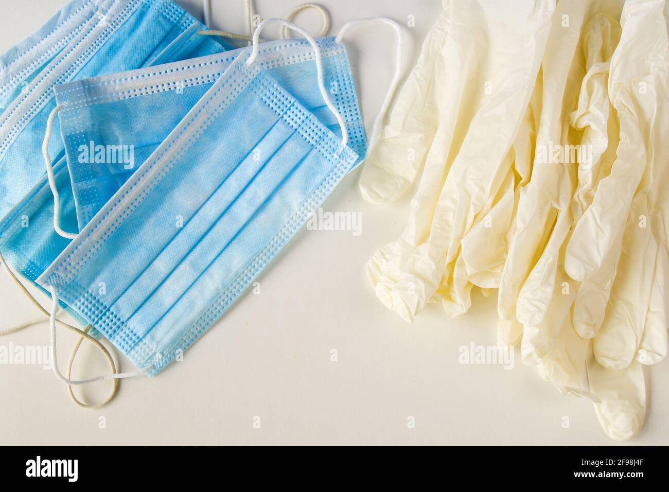 Top view of medical gloves and face masks on whi background Stock Photo ...