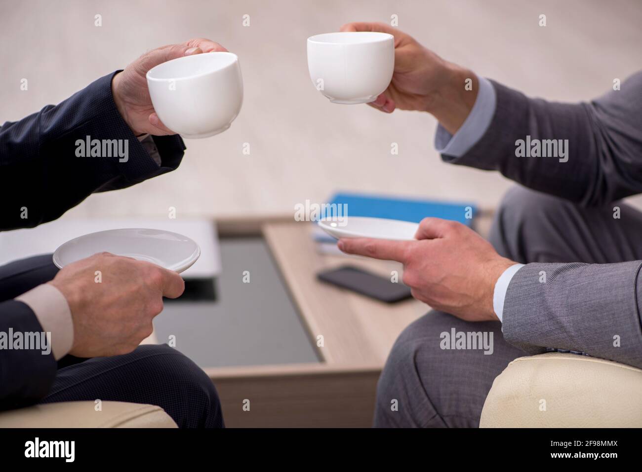 Two businessmen discussing project in the office Stock Photo