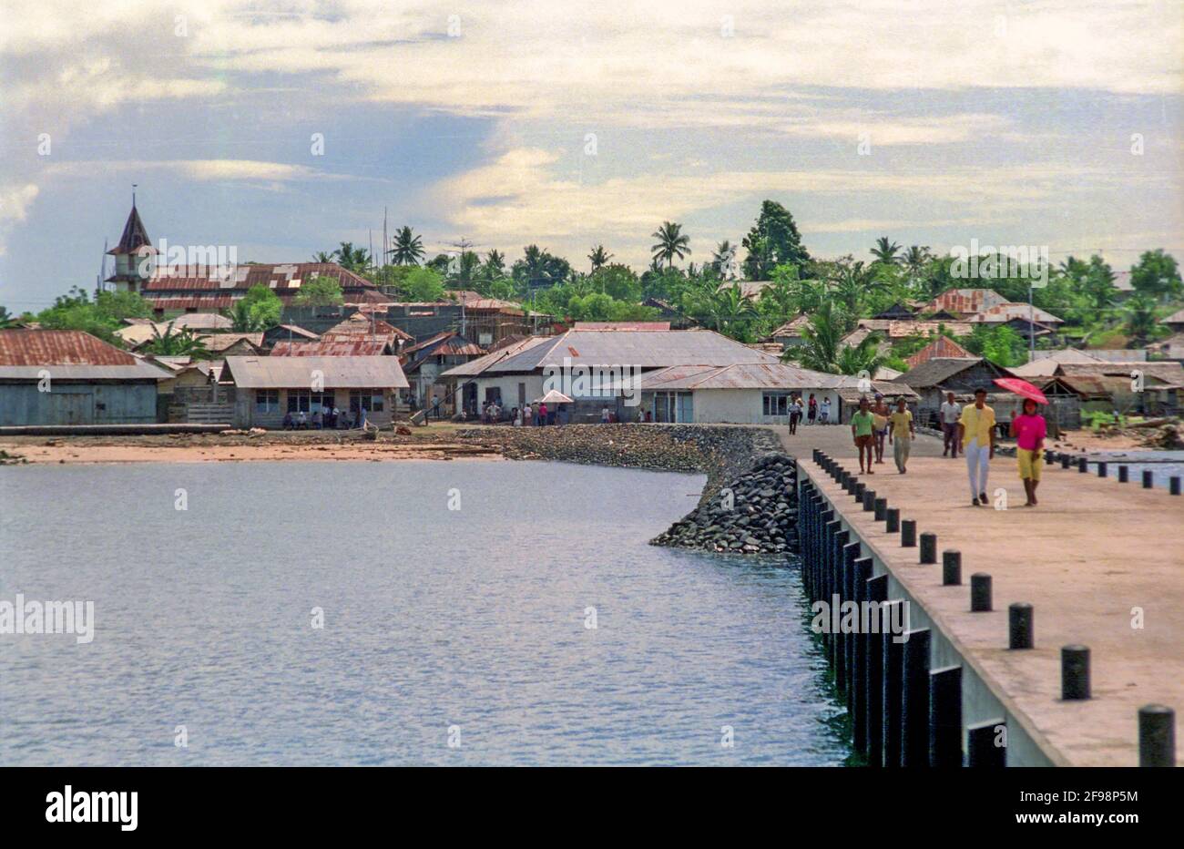 The wharf at Daruba, the main settlement on Morotai, a sparsely-developed island in the Halmahera group of eastern Indonesia's Maluku Islands (1989). In 1945  this remote island - now rarely visited by outsiders - became a major staging point in the Pacific Campaign as Allied forces mopped up the occupying Japanese forces.  Thousands of Allied servicemen passed through the base on the island's southern extremity. Stock Photo