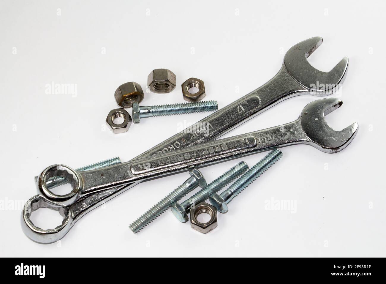 Tools and bolts isolated against a white background Stock Photo Alamy