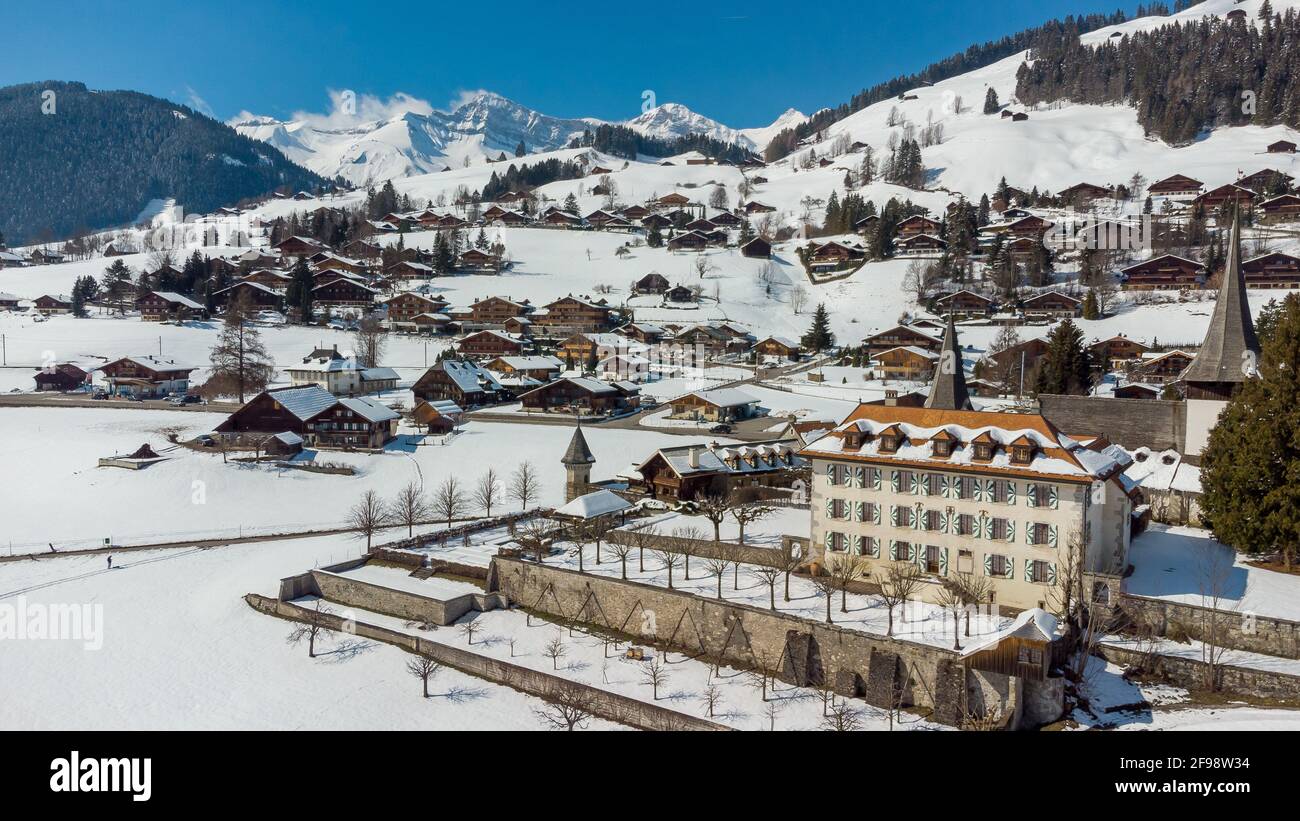 Breathtaking aerial view of the snow-capped village of Rougemont, Switzerland Stock Photo