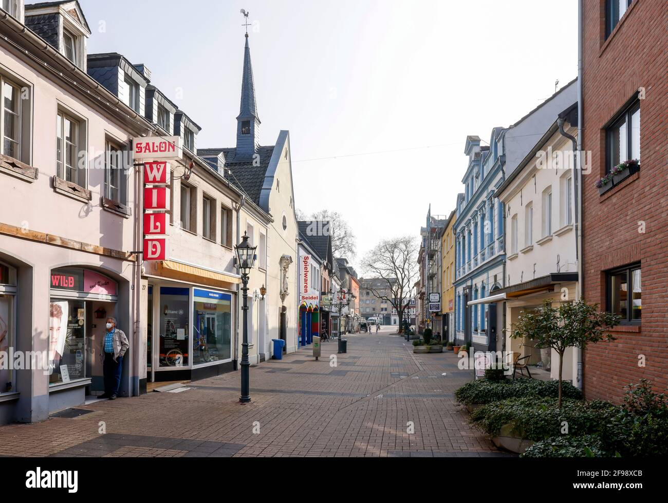 Krefeld, North Rhine-Westphalia, Germany - Krefeld Uerdingen in times of the corona crisis with the second lockdown, most shops are closed, only a few passers-by are walking on Oberstrasse, the main shopping street in the district. Stock Photo