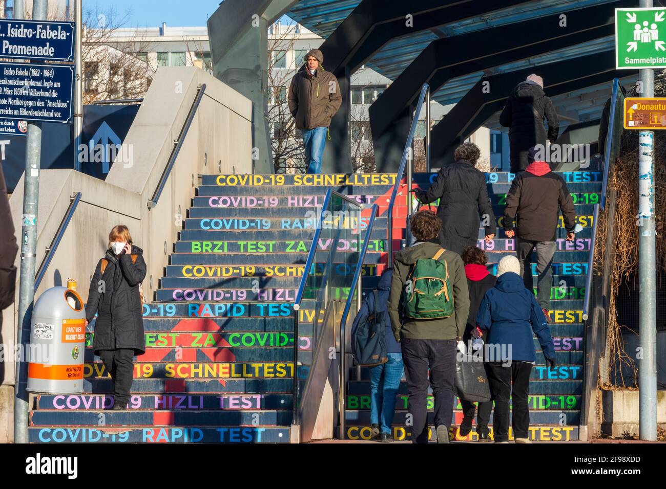 Vienna, people go up steps to free COVID-19 rapid test from the City of Vienna in Austria Center Vienna, stages with the imprint 'COVID-19 rapid test' in 22. Donaustadt, Vienna / Wien, Austria Stock Photo