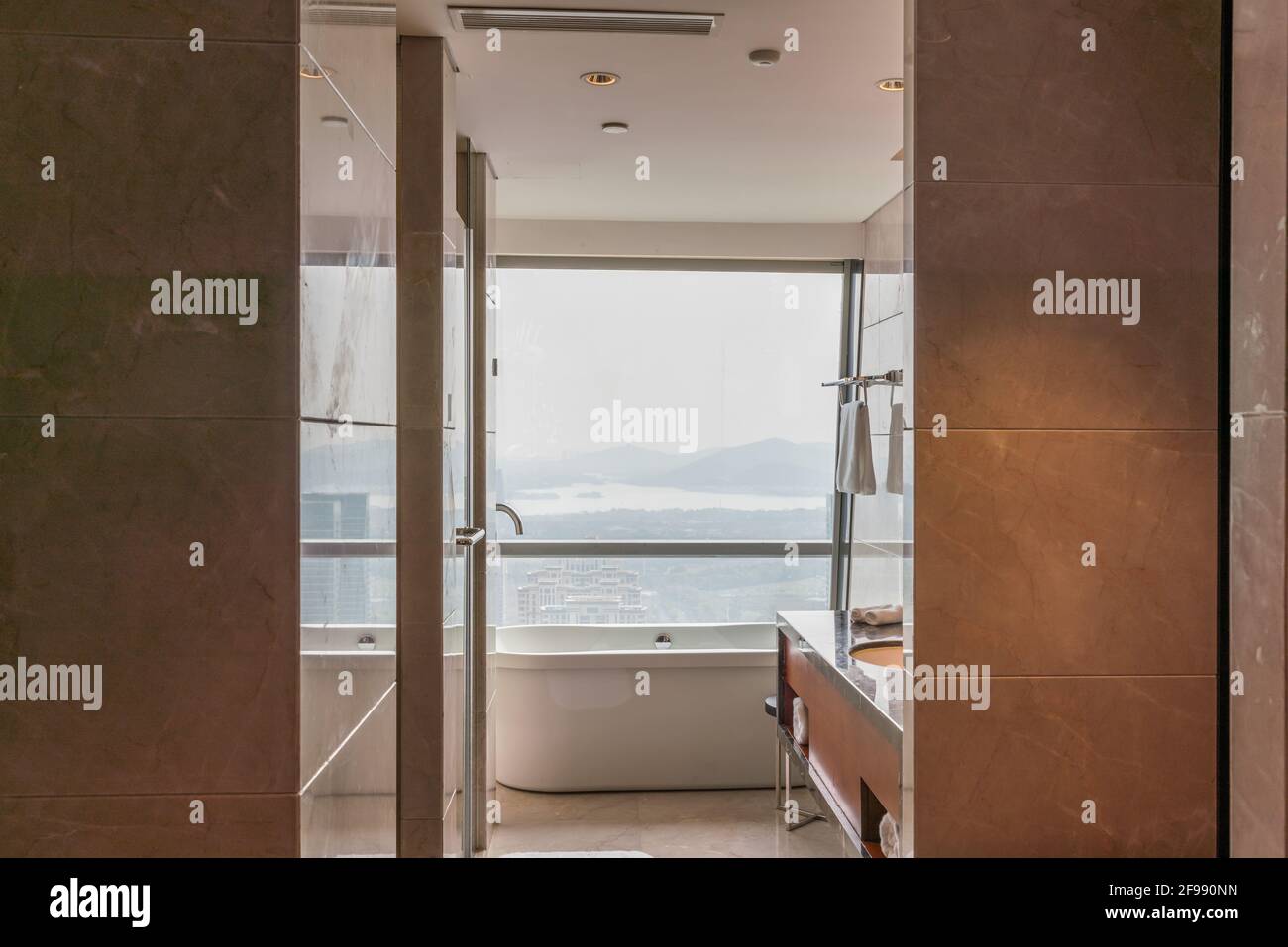 Modern luxury hotel bathroom and bathtub Stock Photo - Alamy