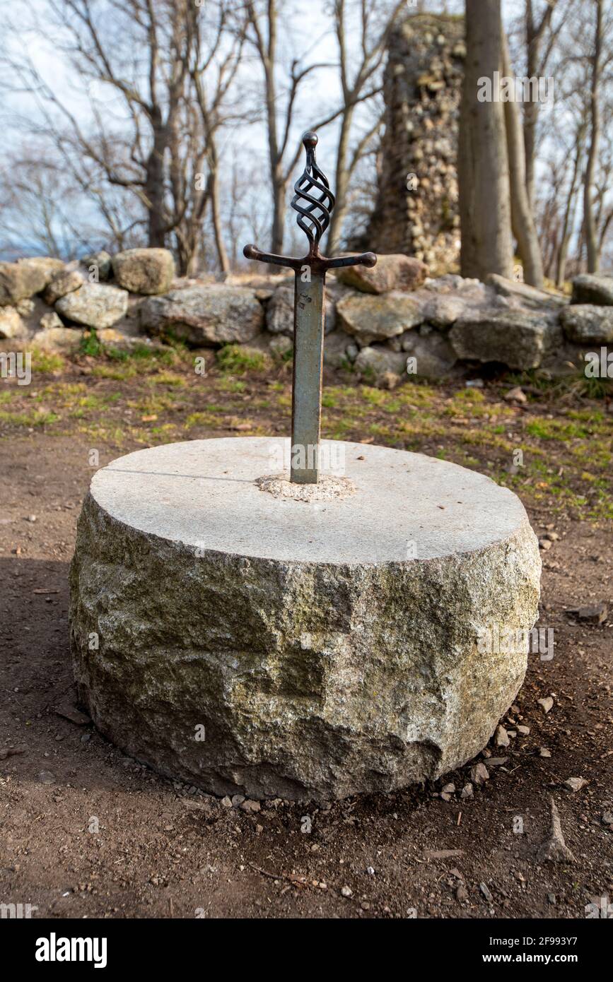 Germany, Saxony-Anhalt, Stecklenberg, sword stuck in a stone, Lauenburg castle ruins, built in the 12th century, Harz. Stock Photo