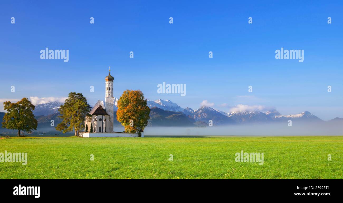 Church of St. Coloman near Schwangau in the morning light in front of ...