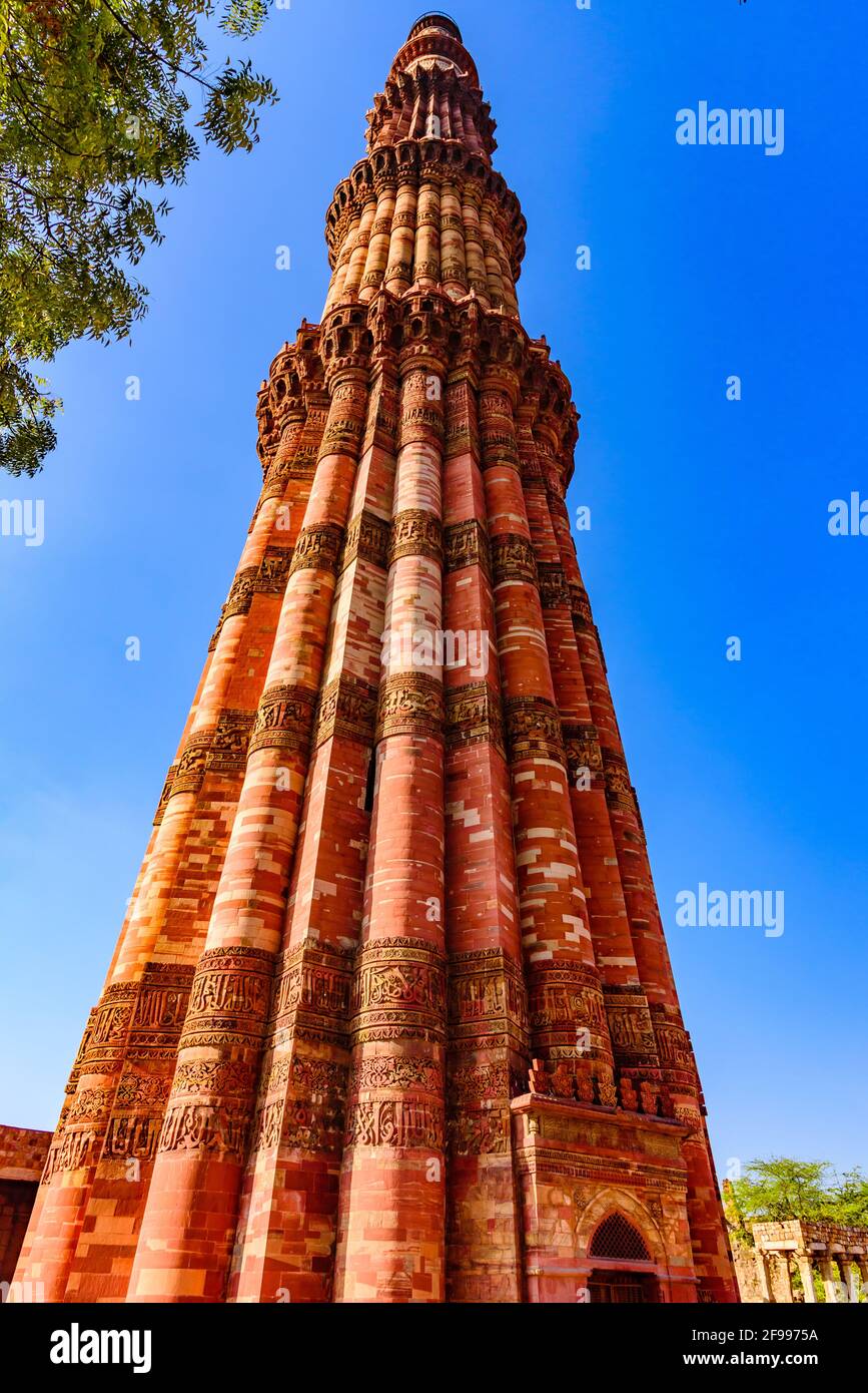 Qutub Minar is a highest minaret in India standing 73 m tall tapering tower of five storeys made of red sandstone and marble established in 1192. It i Stock Photo