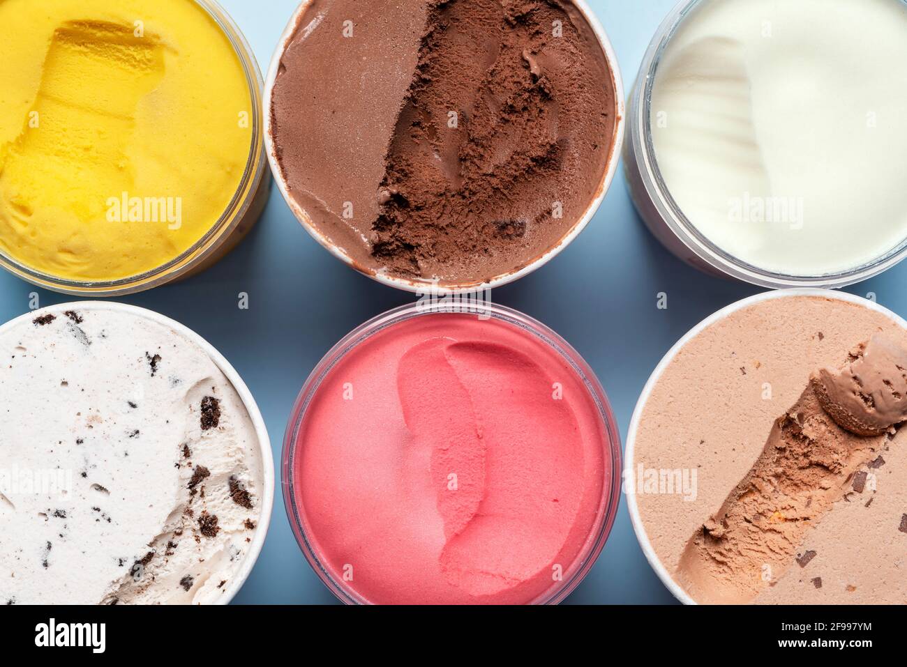 A view of several containers full of popular ice cream toppings on