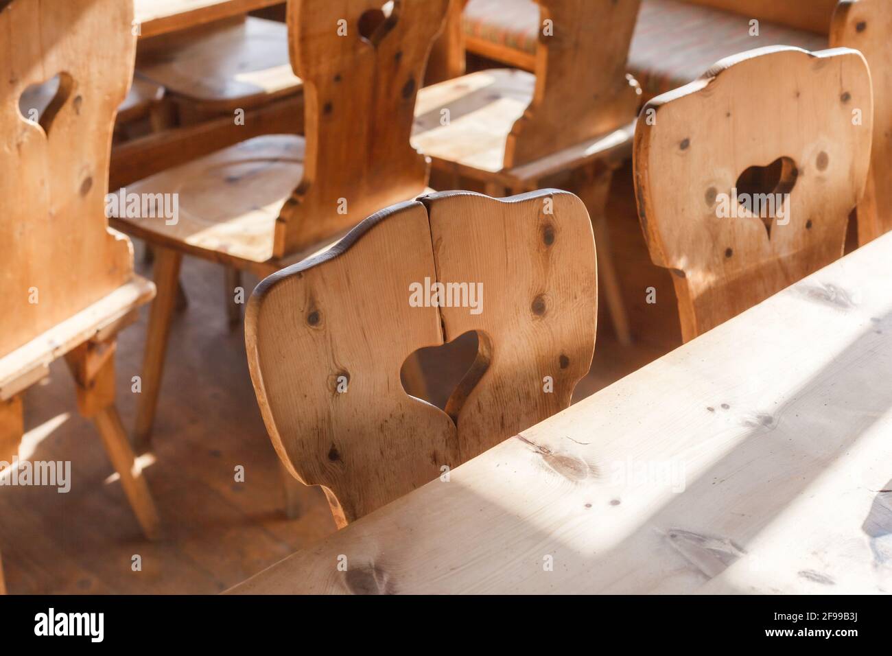Rustic cosiness, wooden chairs - Bavarian, close-up, sitting with a heart Stock Photo