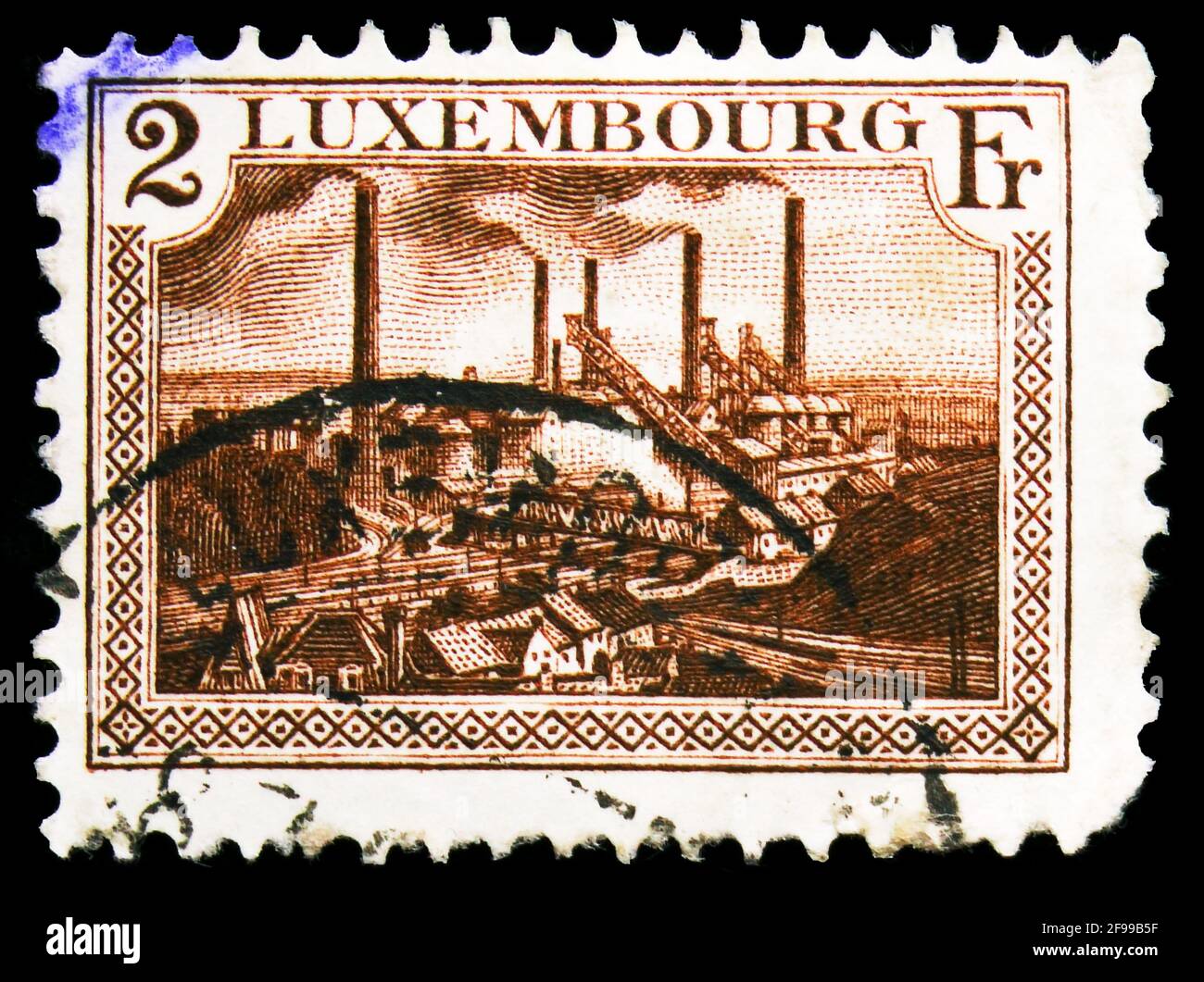 MOSCOW, RUSSIA - NOVEMBER 4, 2019: Postage stamp printed in Luxembourg shows Esch-sur-Alzette Foundries, Arms, Grand Duchess Charlotte and Landscapes Stock Photo