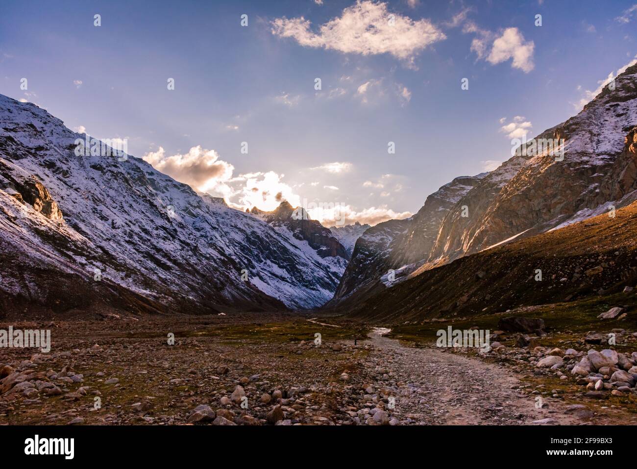 Serene Landscape of Chandra river valley & snow capped mountains during sunset near Rohtang Pass in Lahaul & Spiti district of Himachal Pradesh, India Stock Photo