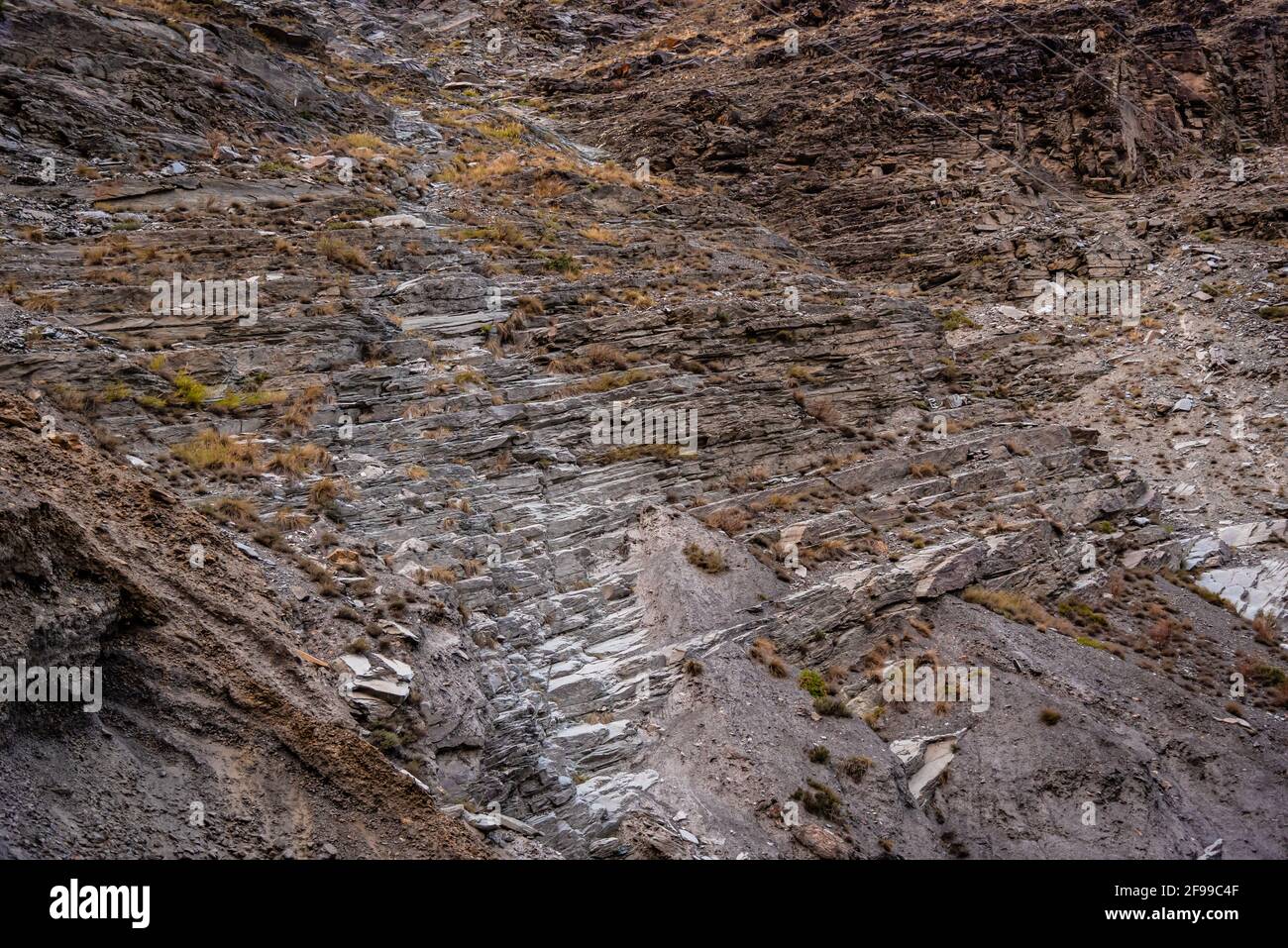 Strata of Slate is a fine-grained  homogeneous metamorphic rock derived from  shale type sedimentary rock composed of clay or volcanic ash. It is foun Stock Photo