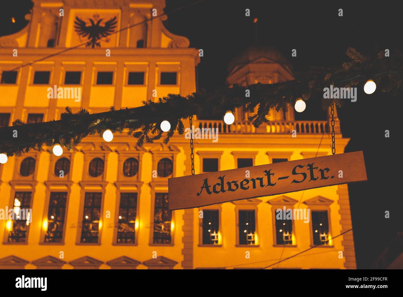 The Augsburger Christkindlesmarkt, Christmas market in Swabia at night. Sign saying Advent-Str. Stock Photo
