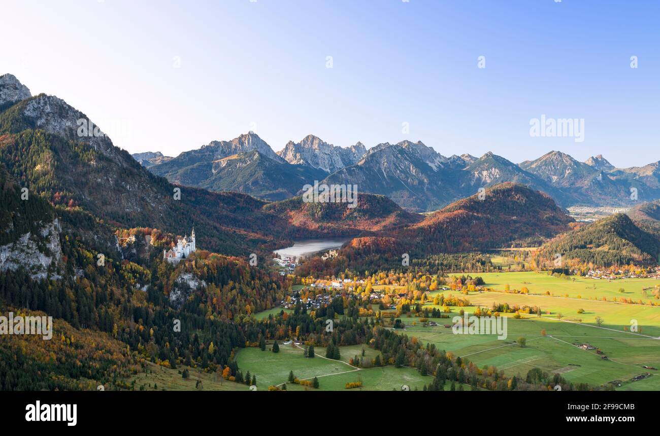 View of Hohenschwangau with the royal castles on a sunny autumn day. In the background the Allgäu Alps. Bavaria, Germany, Europe Stock Photo