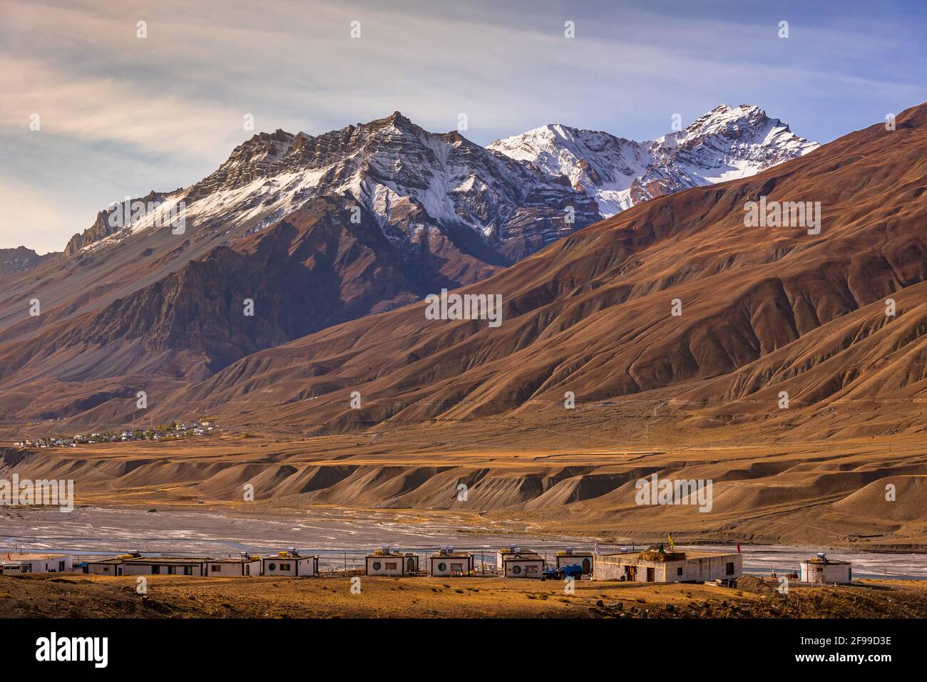Panoramic landscape of Spiti river valley and snow capped mountains during sunrise near Kaza town in Lahaul and Spiti district of Himachal Pradesh, In Stock Photo