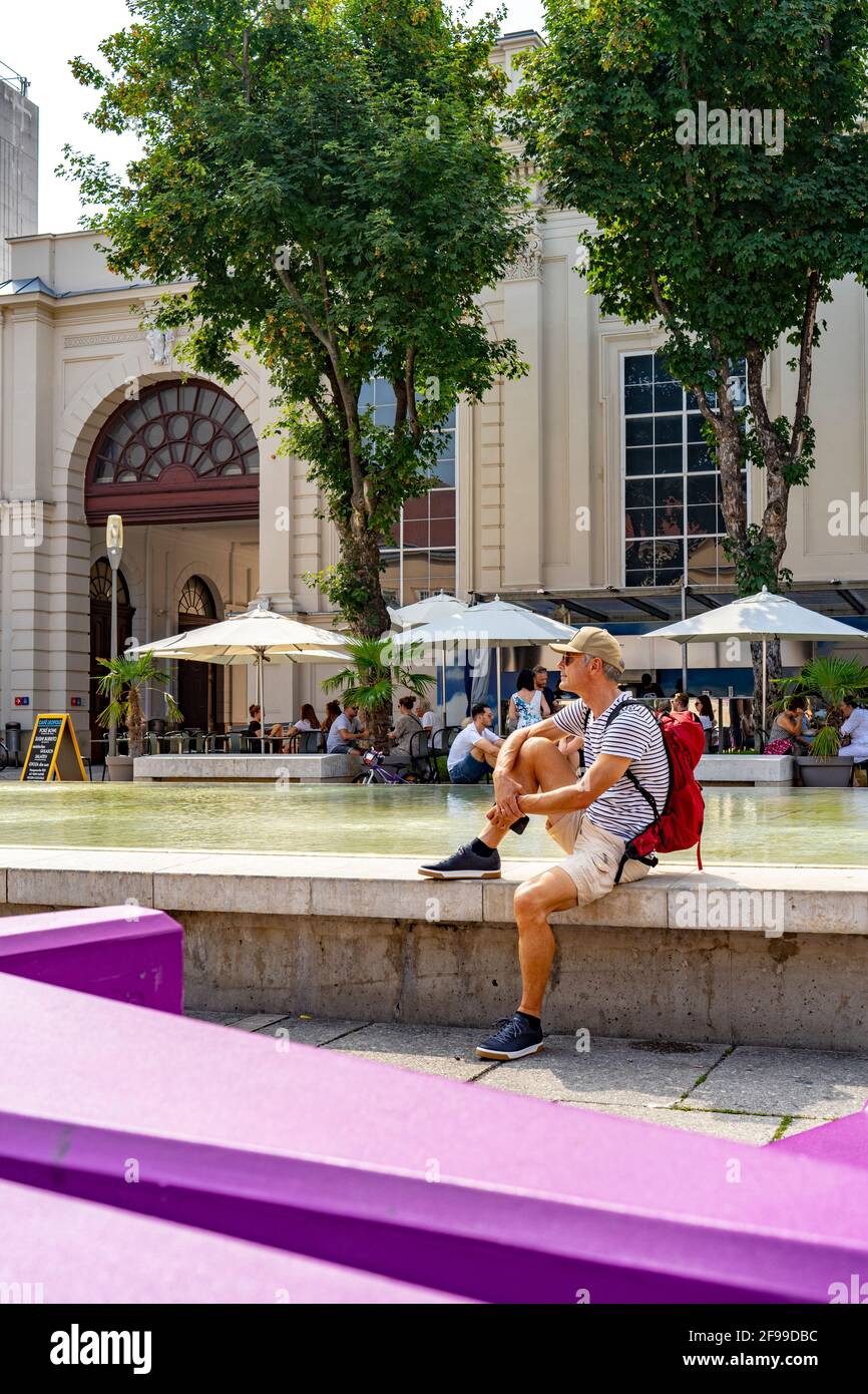 Man relaxes during a visit to the Museumsquartier in Vienna's 7th district, Vienna state, Austria Stock Photo