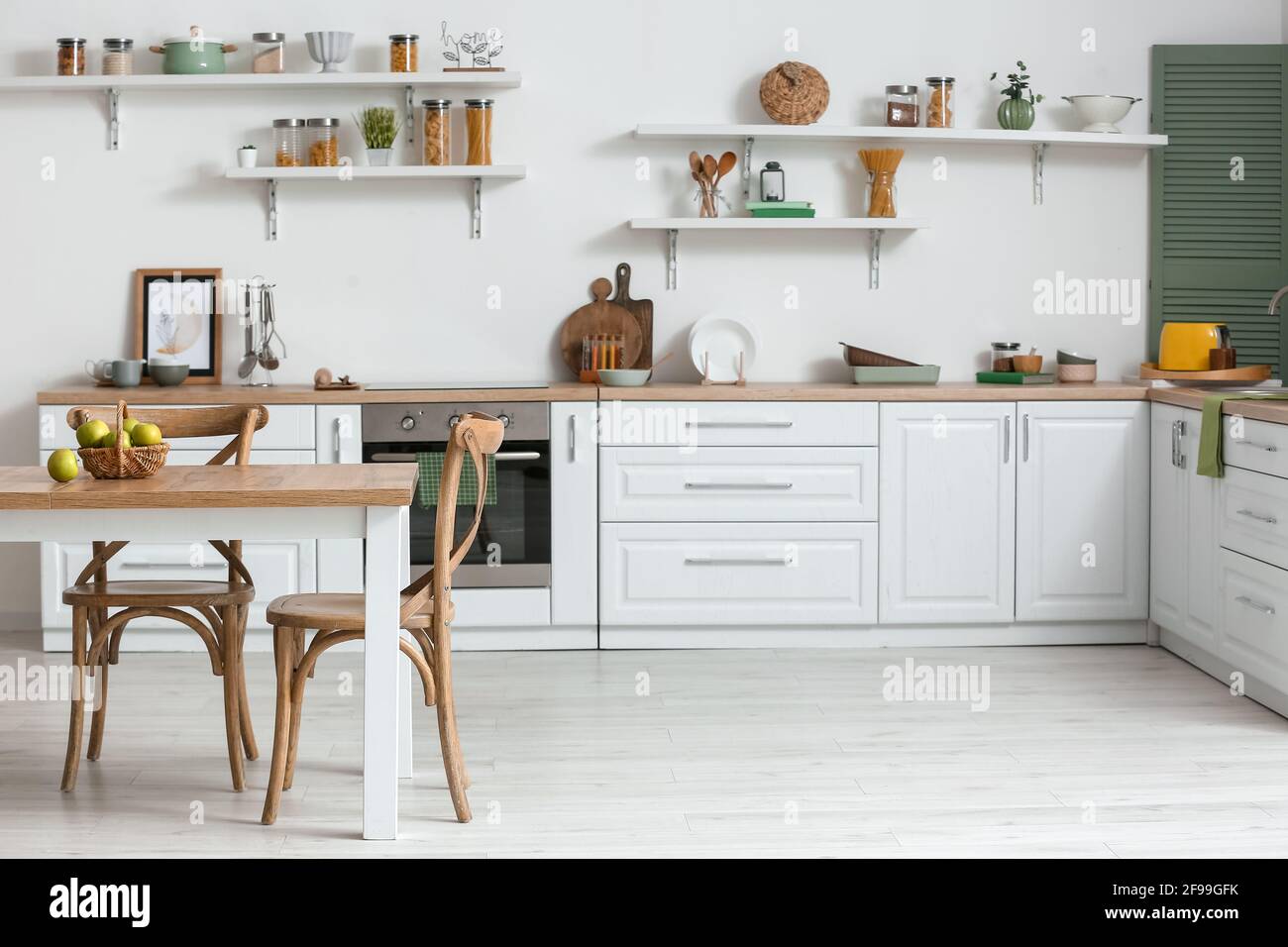 Dining table and chairs in interior of modern kitchen Stock Photo - Alamy
