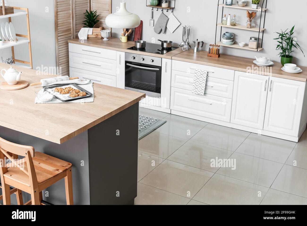 Table in stylish interior of modern kitchen Stock Photo Alamy