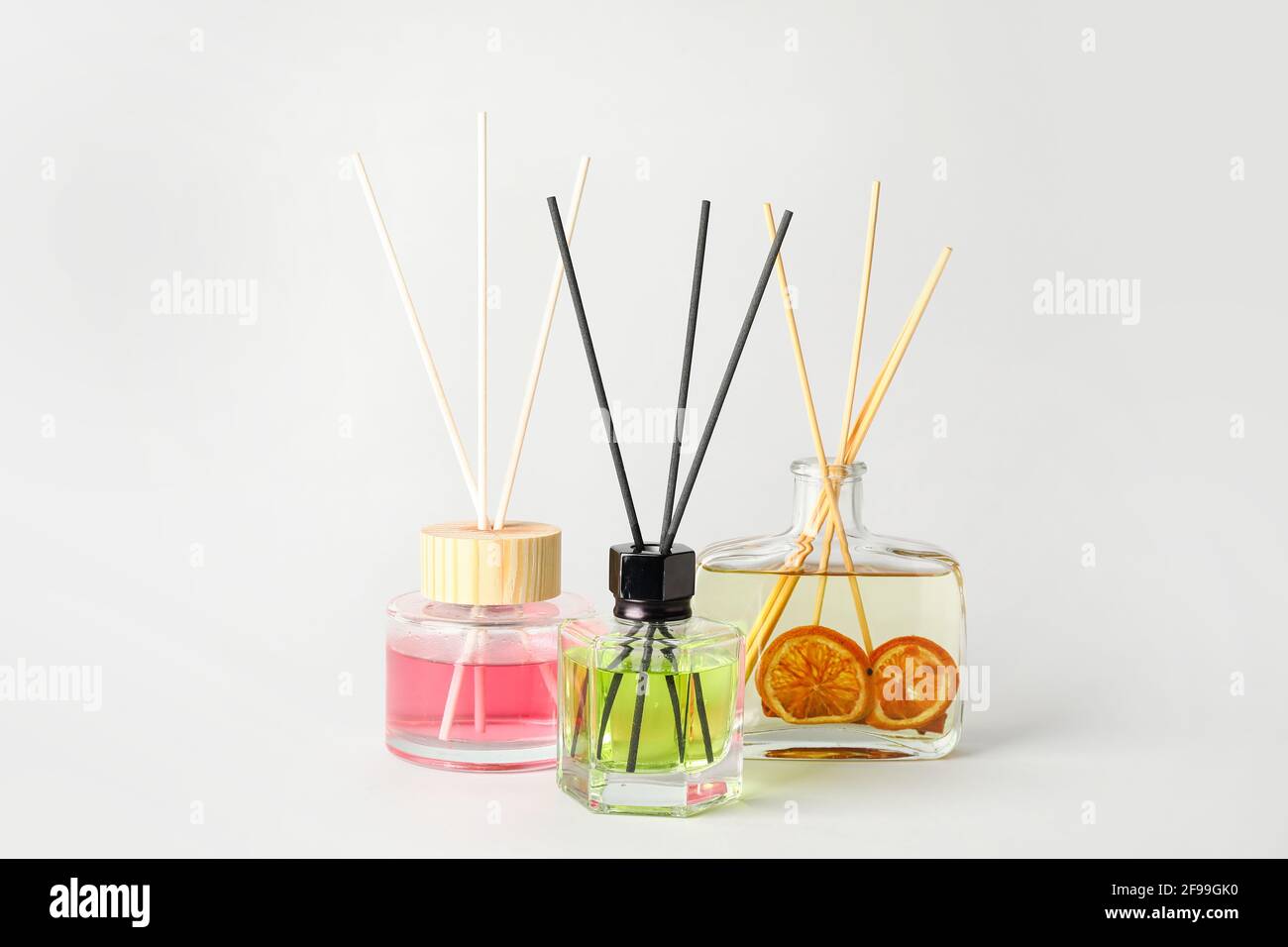 Different reed diffusers on white background Stock Photo