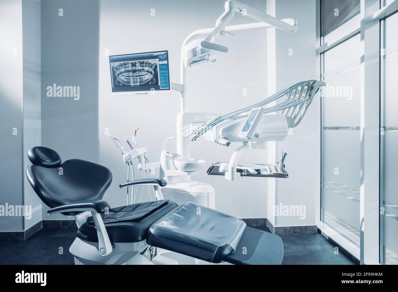 Dental office with dental chair, computer and dentist tools Stock Photo