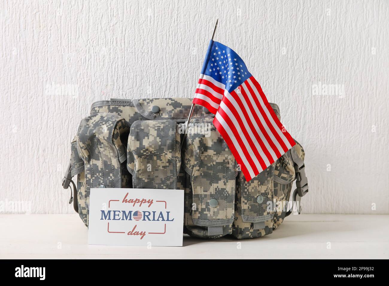 Greeting card for Memorial Day with military bag and USA flag on white ...