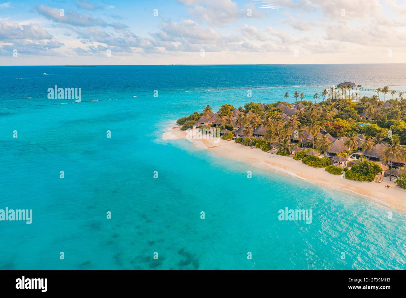 Aerial photo of beautiful paradise tropical beach on island. Summer travel vacation concept. Aerial drone view of beach palm trees with turquoise sea Stock Photo