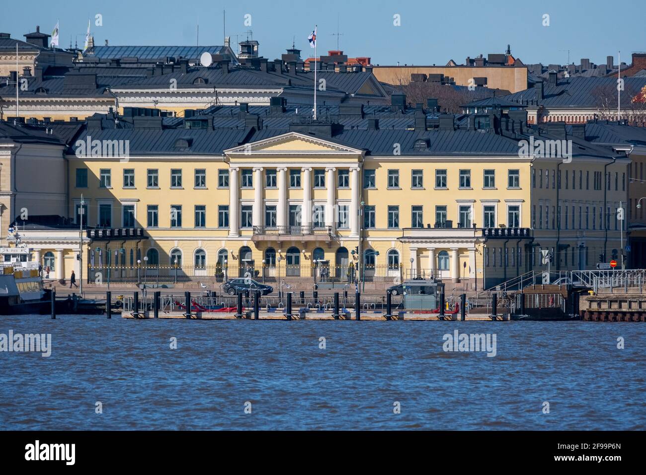Helsinki / Finland - APRIL 16, 2021: The exterior of the Finnish presidential palace on a sunny summer day. Stock Photo