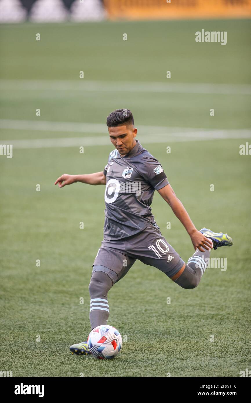 Minnesota United FC midfielder Ethan Finlay (13) kicks the ball during the first half of an MLS match against the Seattle Sounders FC  at Lumen Field, Stock Photo