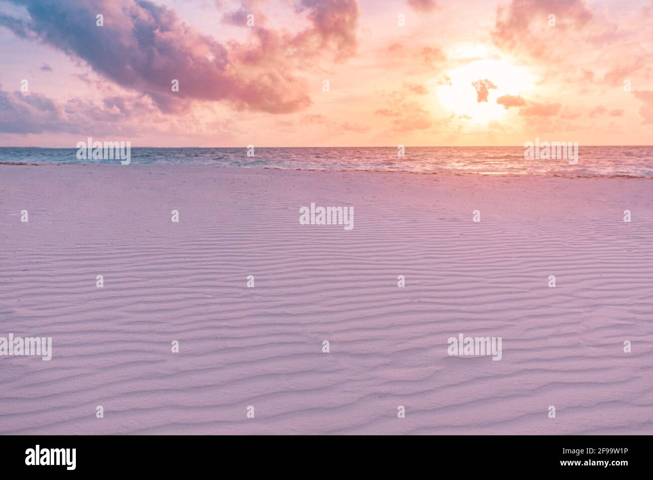 Closeup sea sand beach. Panoramic beach landscape. Inspire tropical beach seascape horizon. Orange and golden sunset sky calmness tranquil relaxing Stock Photo