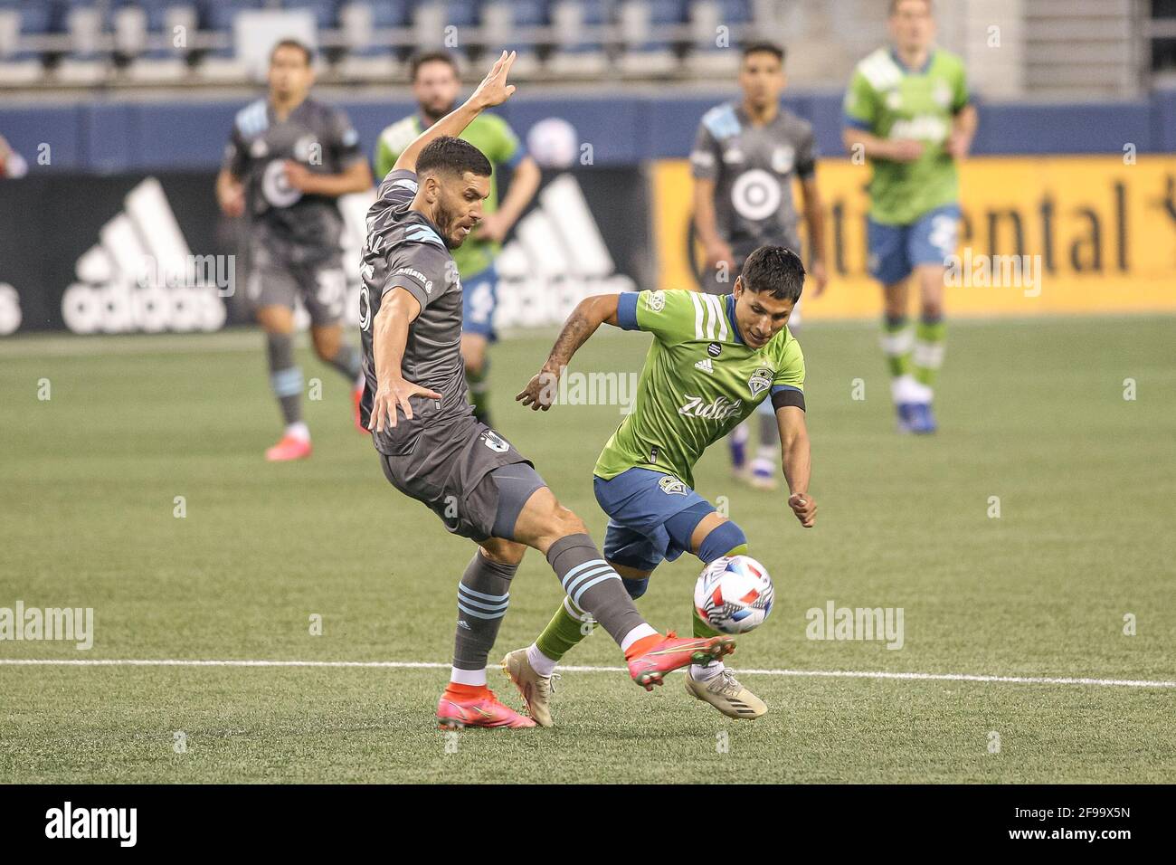 Seattle Sounders FC forward Raul Ruidiaz (9) with the ball against Minnesota United FC defender Michael Boxall (15) during the second half of an MLS m Stock Photo