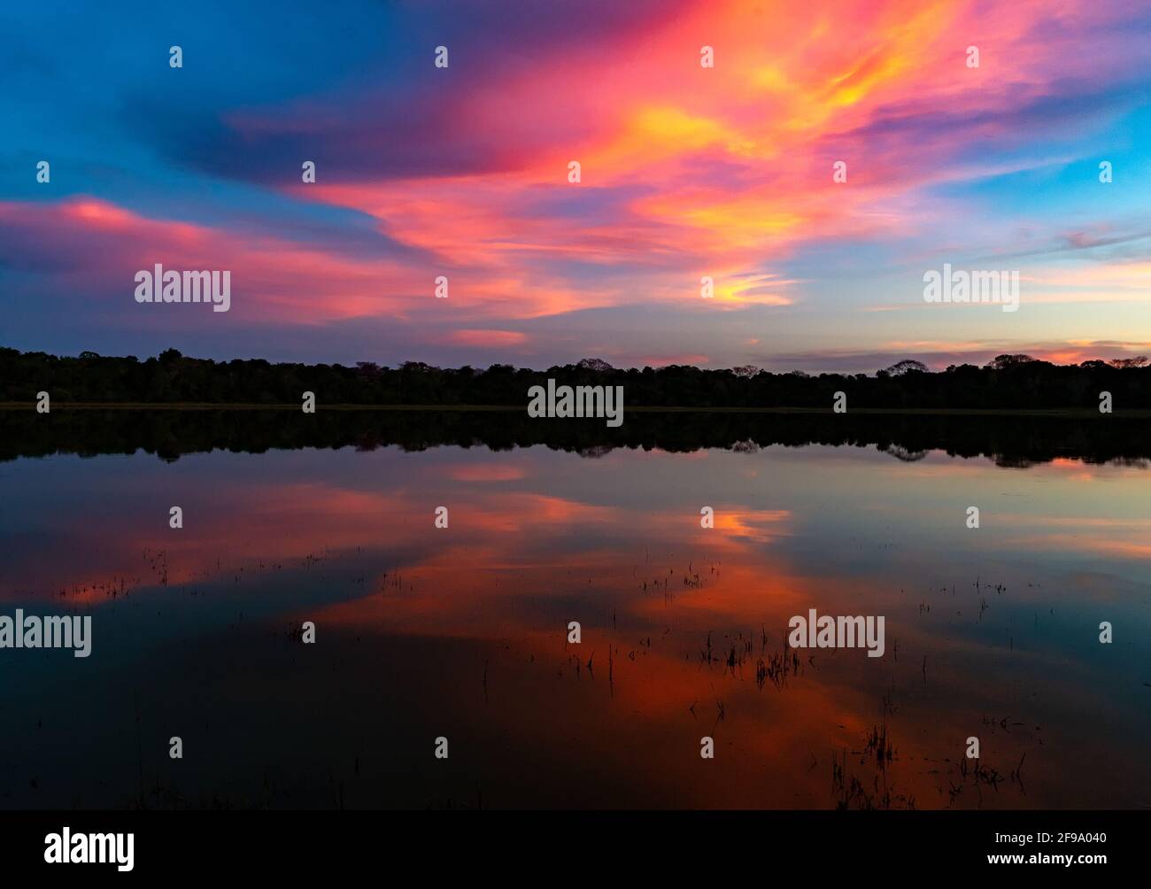 Sunrise with dramatic cloud reflection in the water of the lake Stock ...