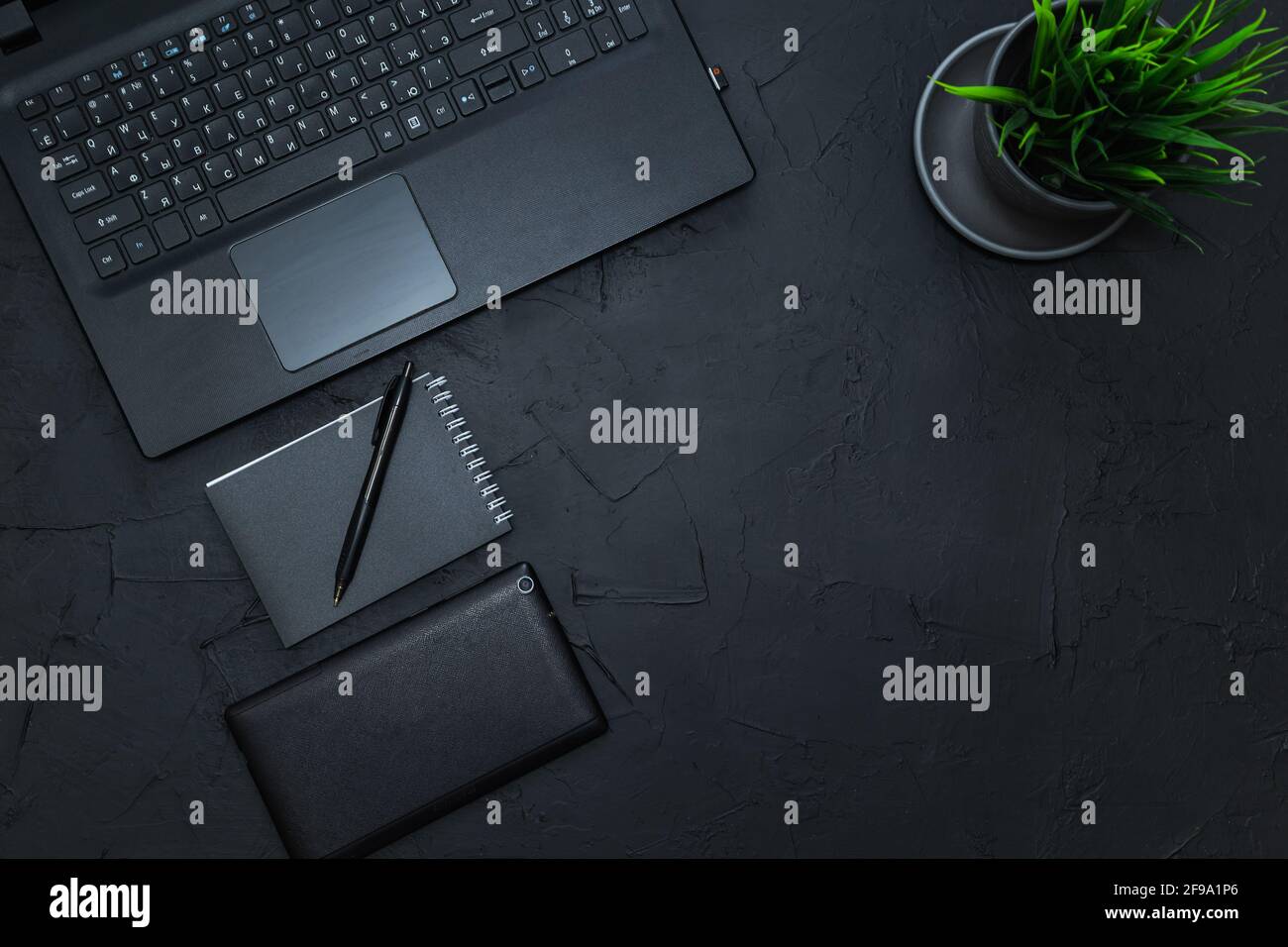 Business accessories on graphite background. Business, distance work, self-study concept. Top view, flat lay, low key. Stock Photo