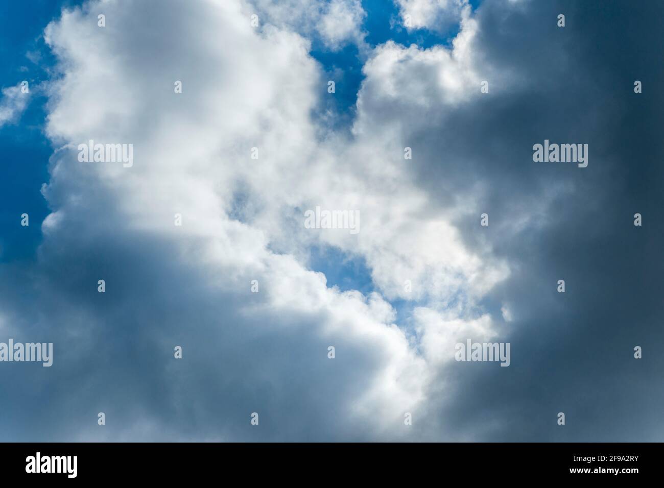 Germany, Baden-Wuerttemberg, cloud mood, white and dark clouds, blue sky Stock Photo