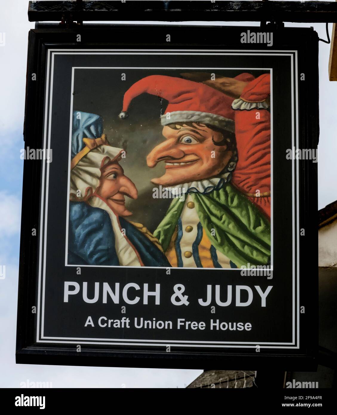 Traditional hanging pub sign Punch and Judy Public House, High Street, Bognor Regis, West Sussex, England, UK Stock Photo