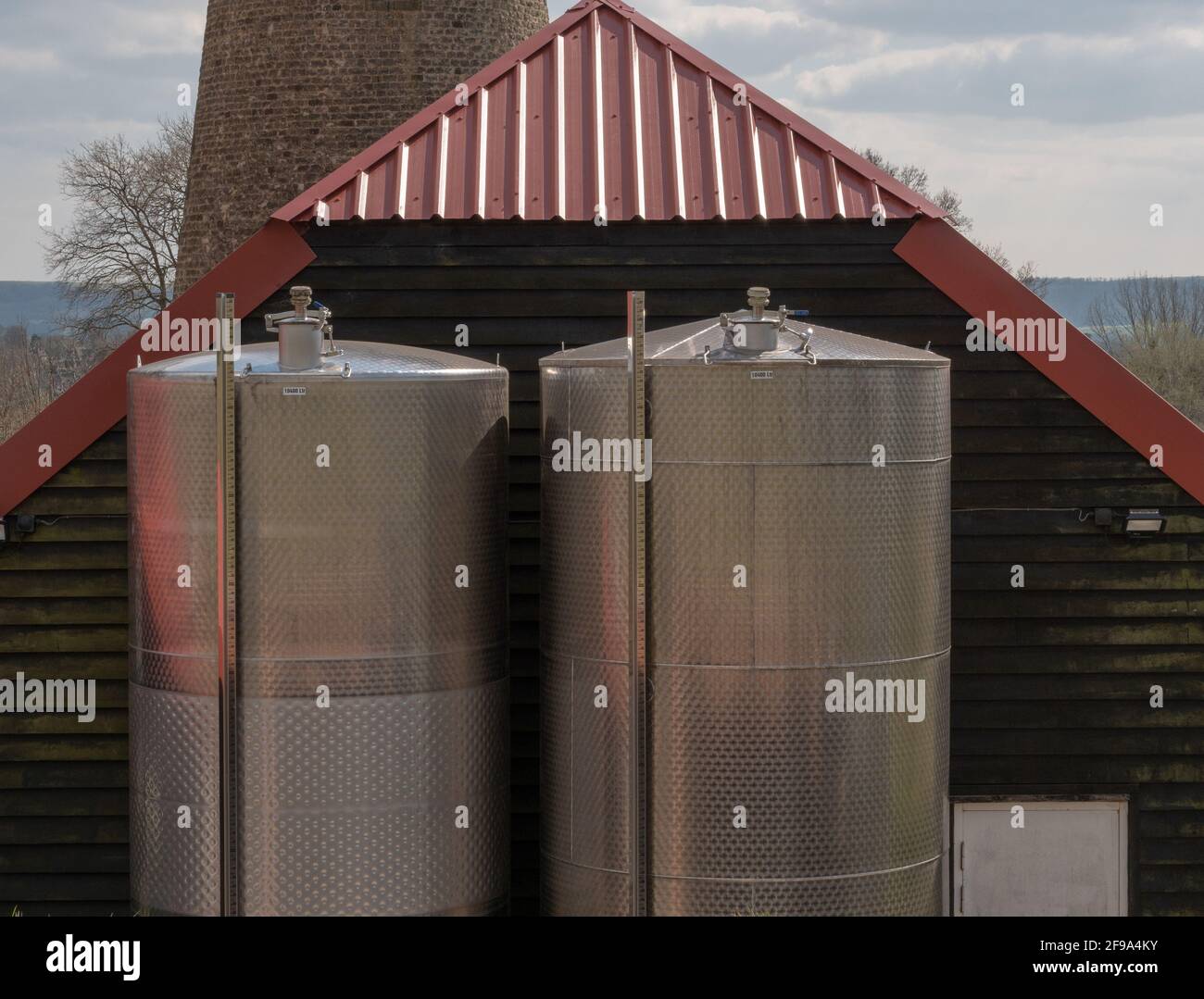 Wine storage tanks seen on a vinyard in the south of England, UK Stock