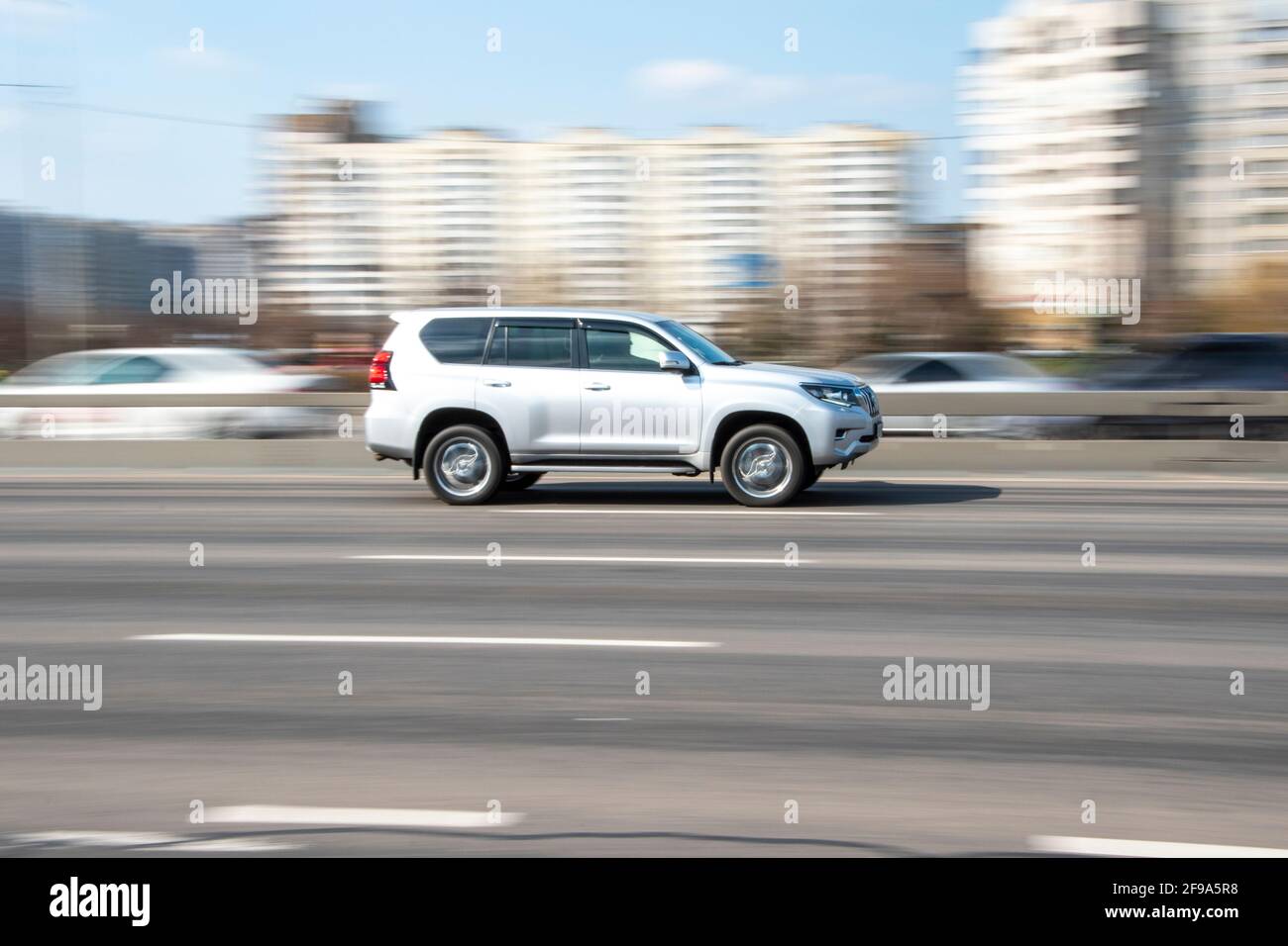 Ukraine, Kyiv - 4 April 2021: Silver Toyota Land Cruiser Prado car moving on the street. Editorial Stock Photo