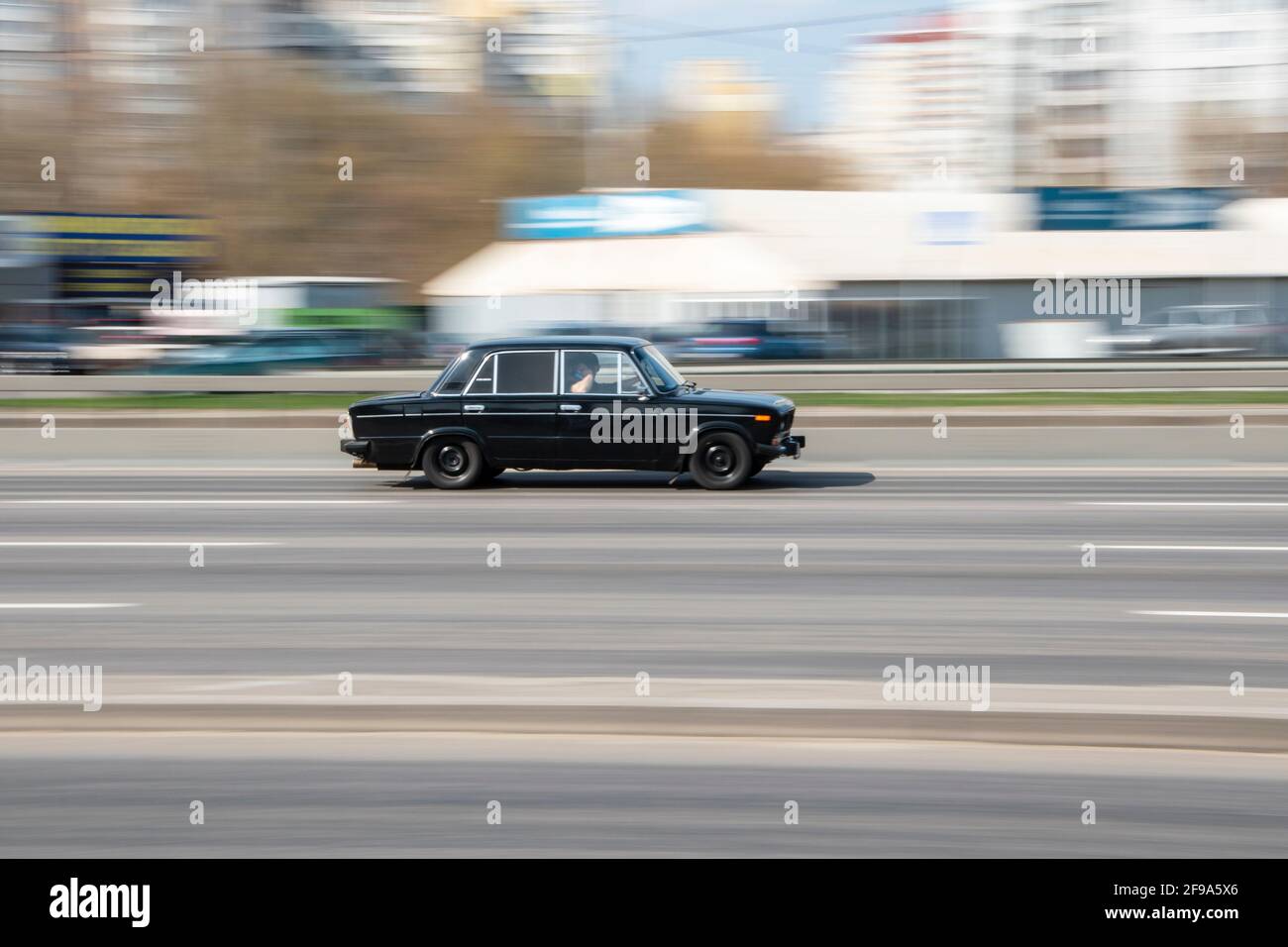 Ukraine, Kyiv - 4 April 2021: Black LADA 2106 car moving on the street. Editorial Stock Photo