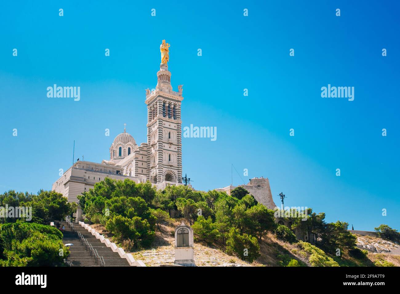 Marseille, France. Catholic Basilica of Our Lady of the Guard or Notre Dame De La Garde church at hill in Marseille, France. Sunny summer sky Stock Photo