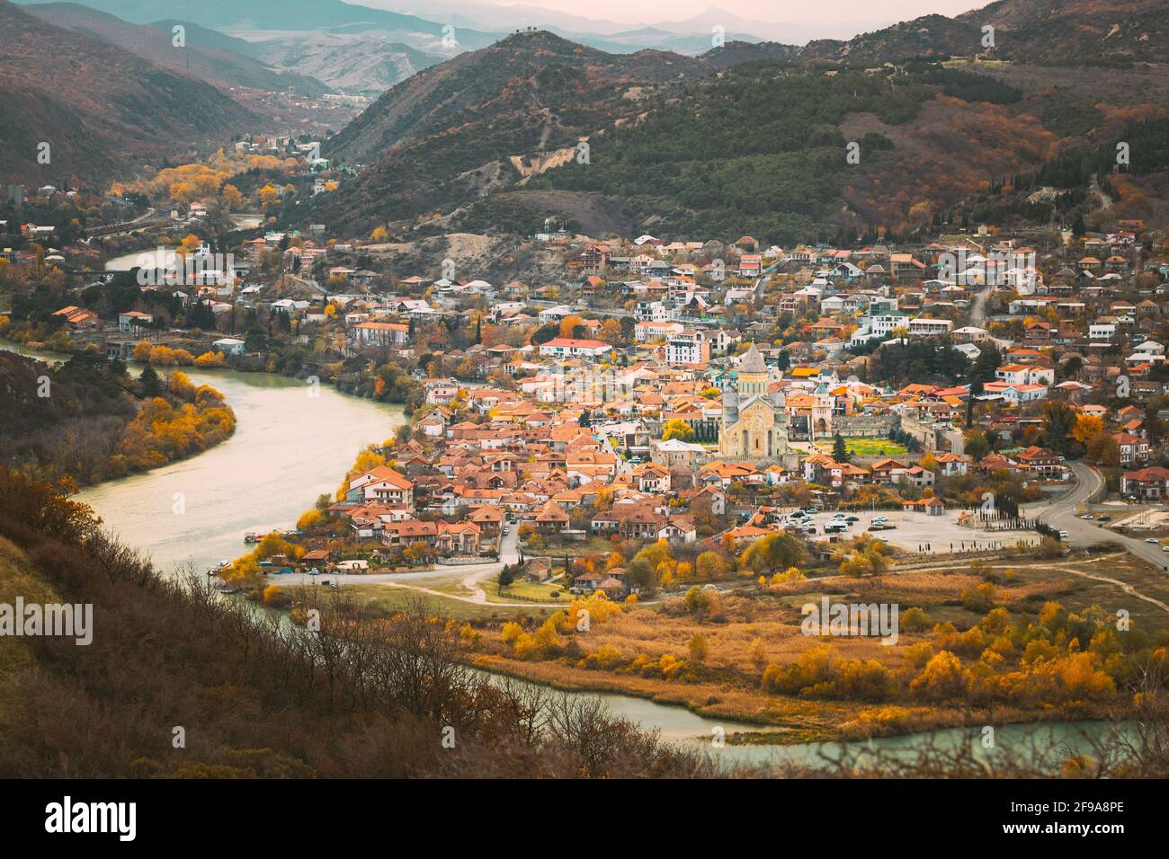 Mtskheta Georgia. Top Rooftop View Of Ancient Town And Svetitskhoveli Cathedral During Autumn Day. UNESCO World Heritage Site Stock Photo